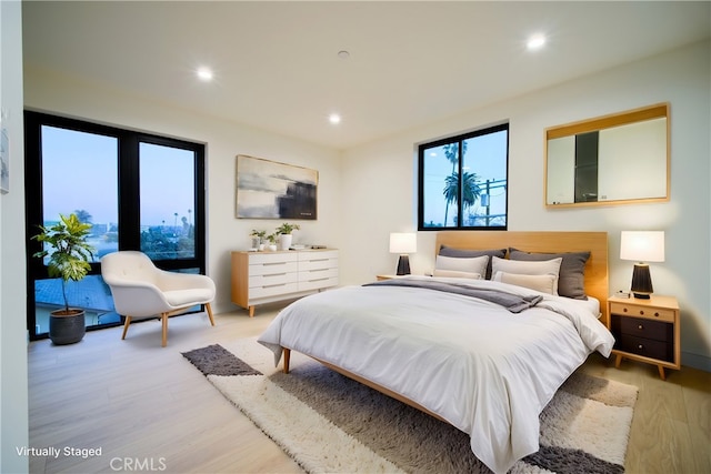 bedroom with light wood-type flooring