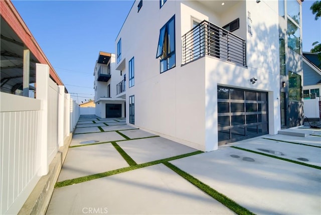 view of side of home with a garage