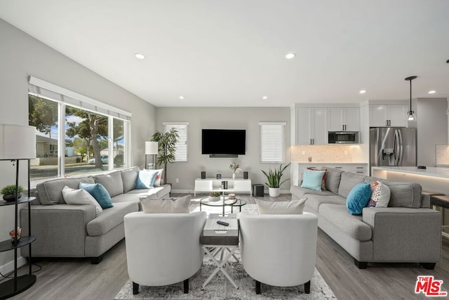 living room with light hardwood / wood-style flooring