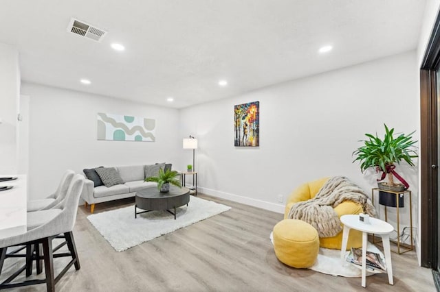 living room with light hardwood / wood-style floors