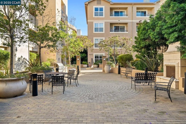 view of property's community featuring a patio area