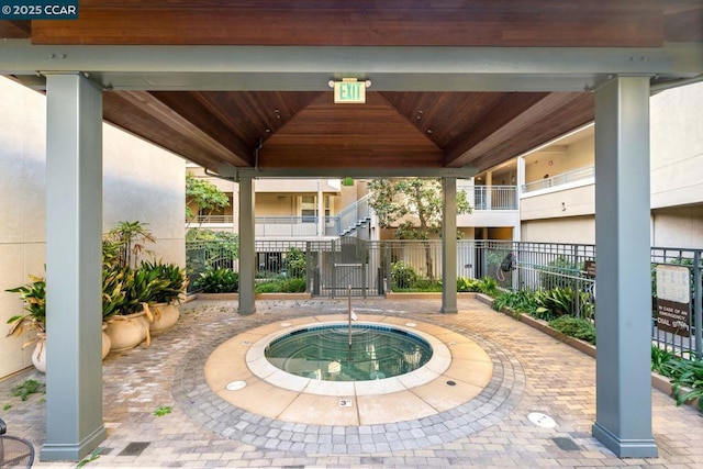 view of pool with a gazebo and a community hot tub