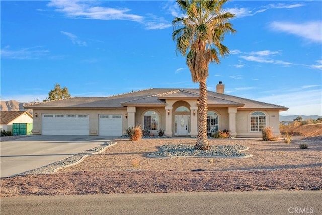 view of front of home with a garage