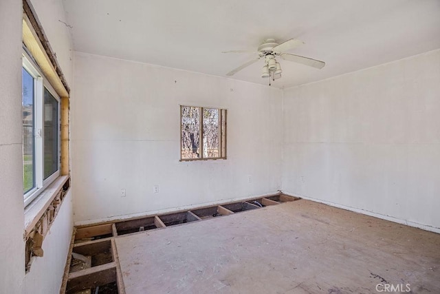 unfurnished room with ceiling fan