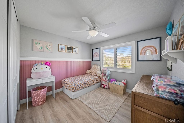 bedroom featuring ceiling fan and light hardwood / wood-style floors