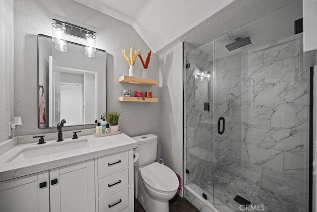 bathroom featuring toilet, a textured ceiling, lofted ceiling, an enclosed shower, and vanity