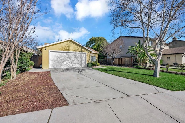 view of front of property with a garage and a front yard