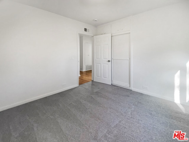 unfurnished bedroom with carpet