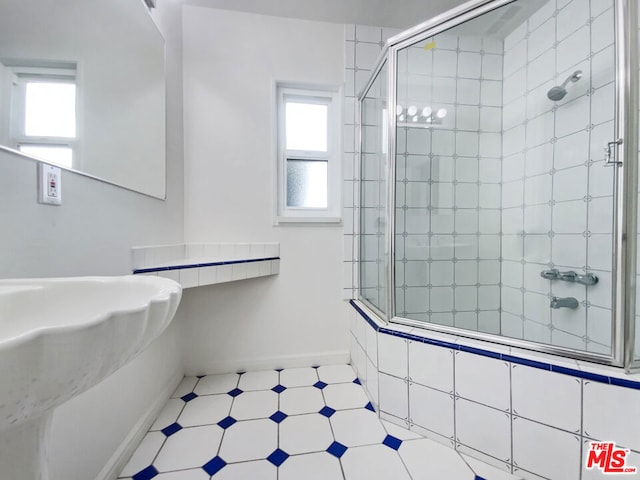 bathroom with a tile shower