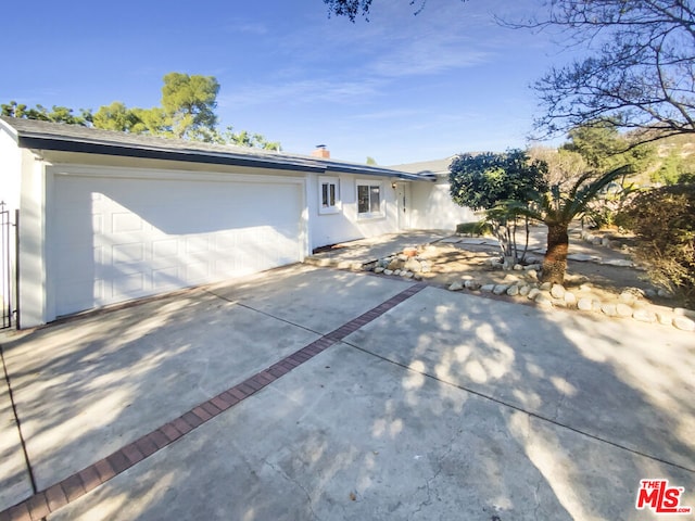 single story home featuring a garage