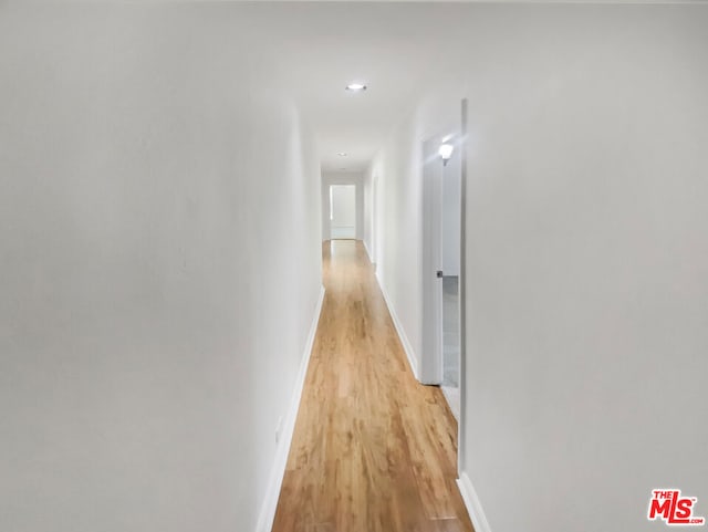 corridor featuring light hardwood / wood-style floors