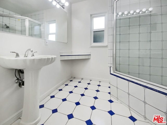 bathroom with a shower with shower door