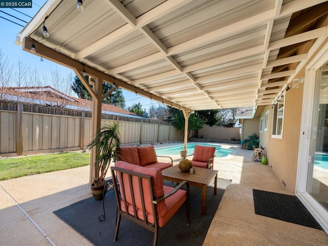 view of patio featuring a fenced in pool and an outdoor living space