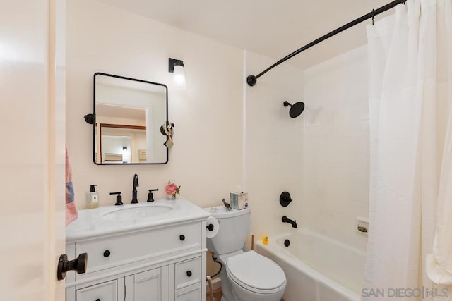 full bathroom featuring toilet, shower / bathtub combination with curtain, and vanity