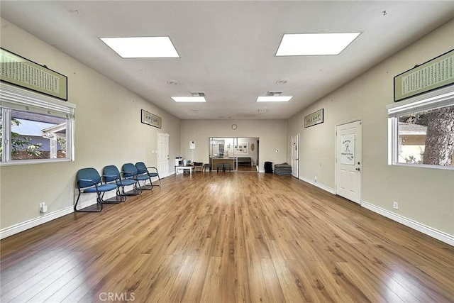 miscellaneous room featuring light hardwood / wood-style floors and a healthy amount of sunlight