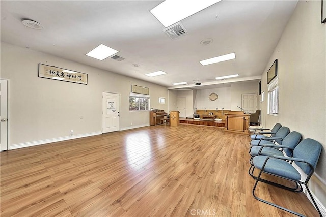sitting room featuring light hardwood / wood-style flooring