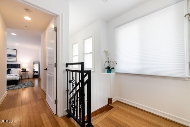 hallway with wood-type flooring