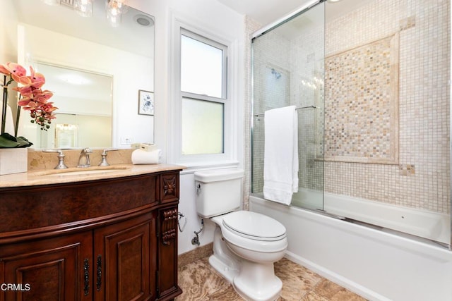 full bathroom with toilet, bath / shower combo with glass door, tile patterned floors, and vanity