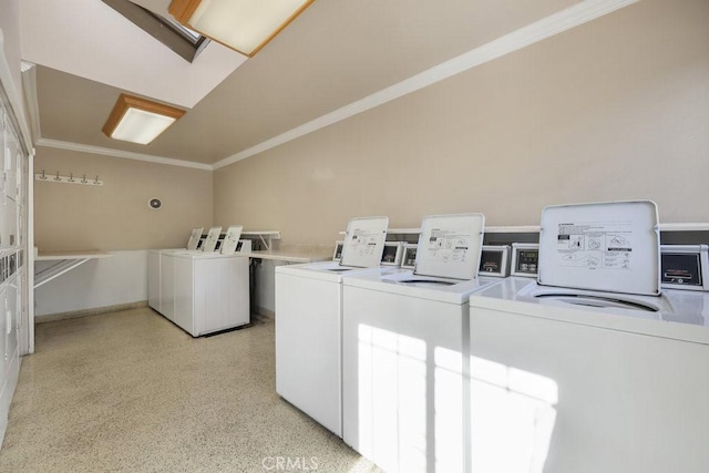 shared laundry area featuring ornamental molding and washer and dryer