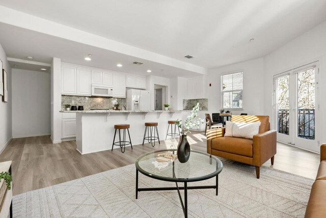 living room with light hardwood / wood-style floors