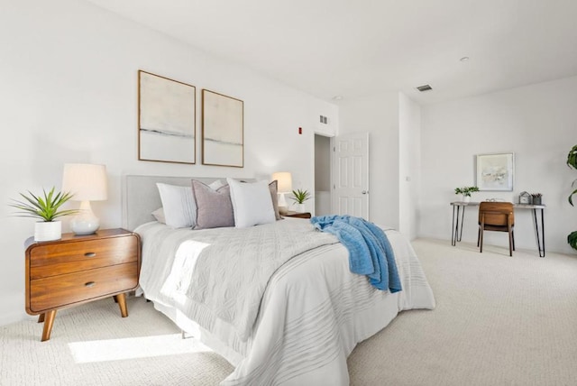 bedroom featuring light carpet