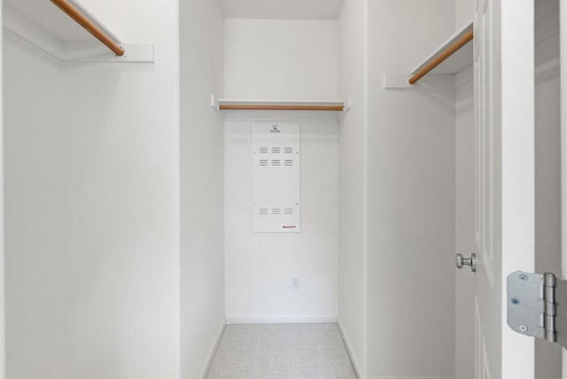 spacious closet featuring tile patterned flooring