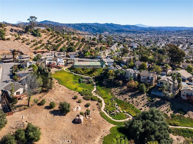 birds eye view of property with a mountain view and a residential view