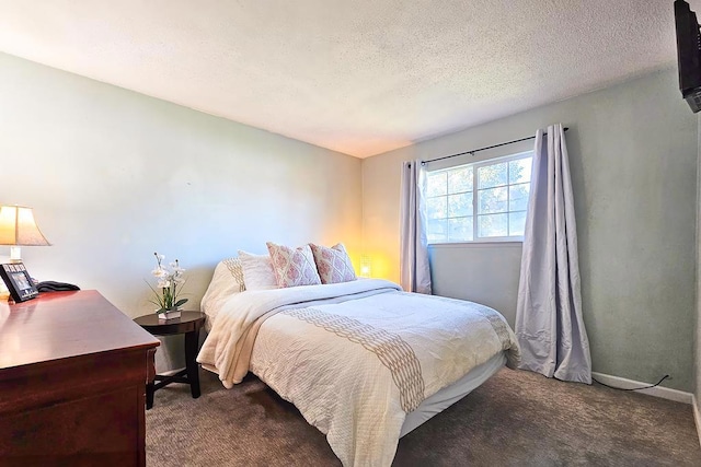 carpeted bedroom with a textured ceiling