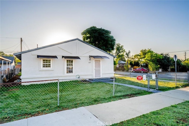 view of front of home with a yard