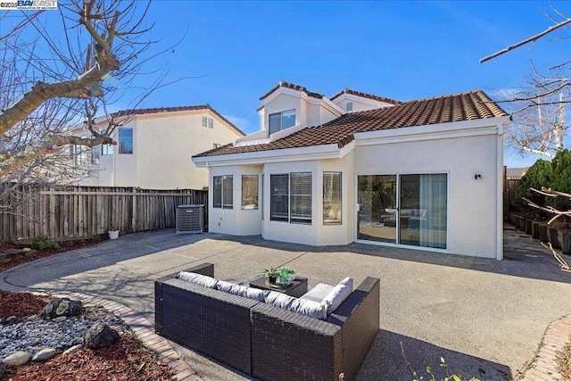 back of house with a patio, central AC, and an outdoor living space