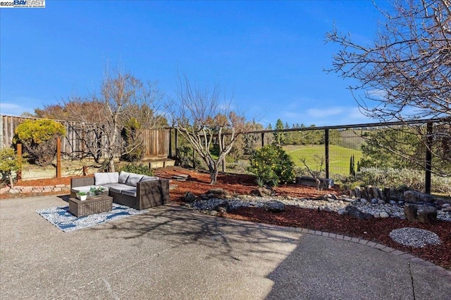 view of yard with a patio area and an outdoor living space