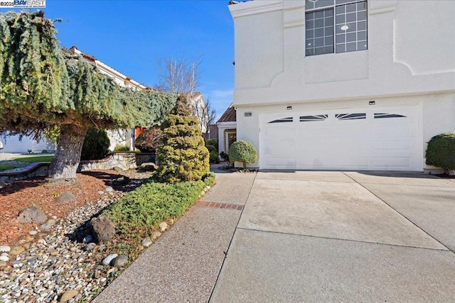 view of side of home featuring a garage