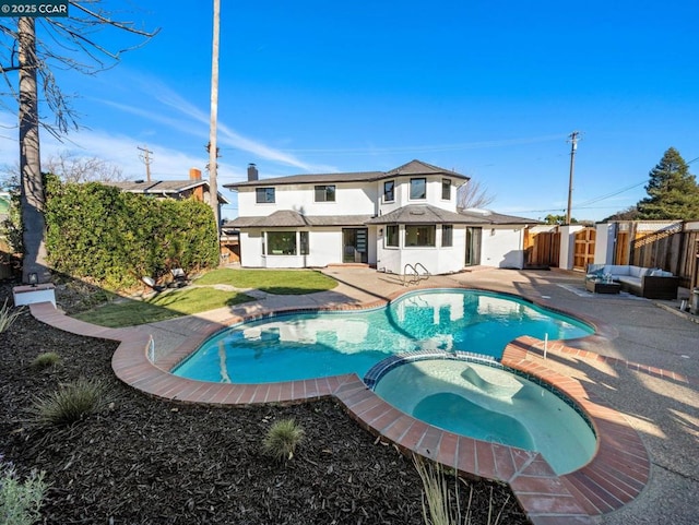 view of pool with an outdoor hangout area, an in ground hot tub, and a patio