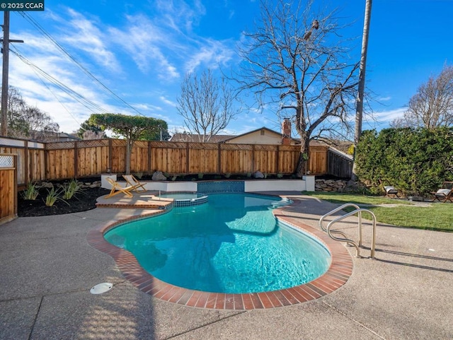 view of pool with a patio and an in ground hot tub