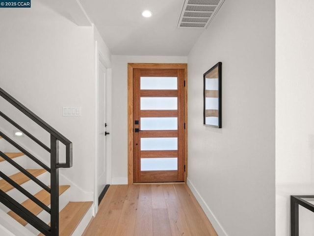 entryway with light hardwood / wood-style floors