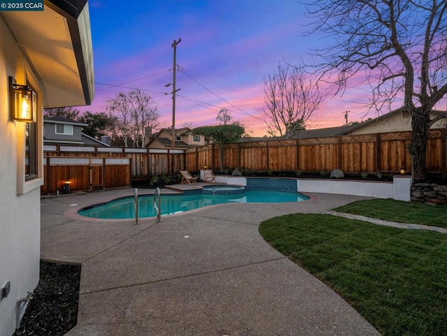 pool at dusk featuring a patio and a lawn