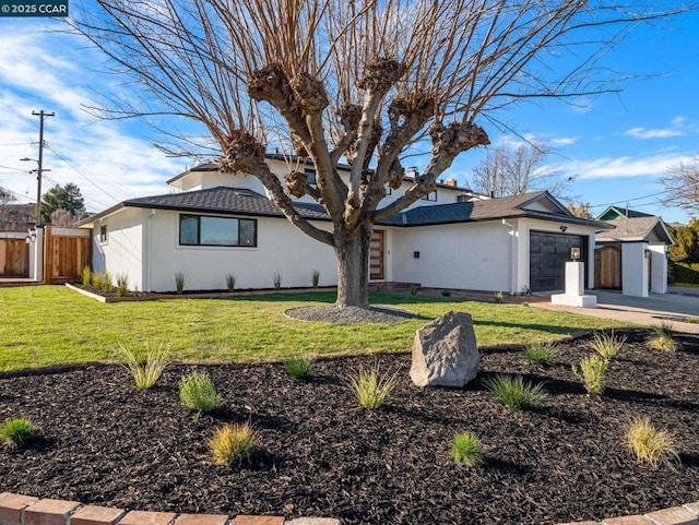 view of front facade with a front lawn and a garage