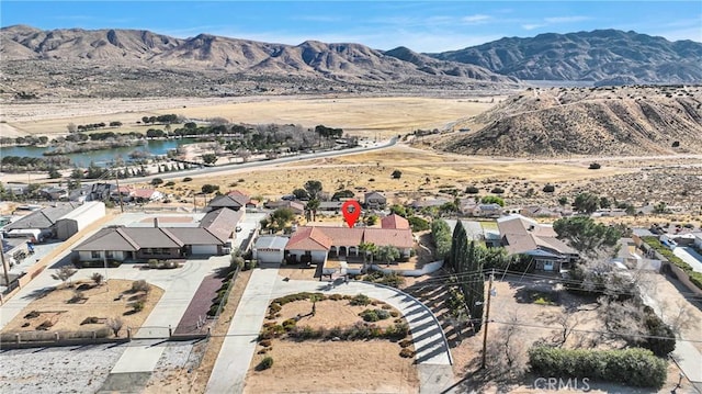 aerial view with a water and mountain view