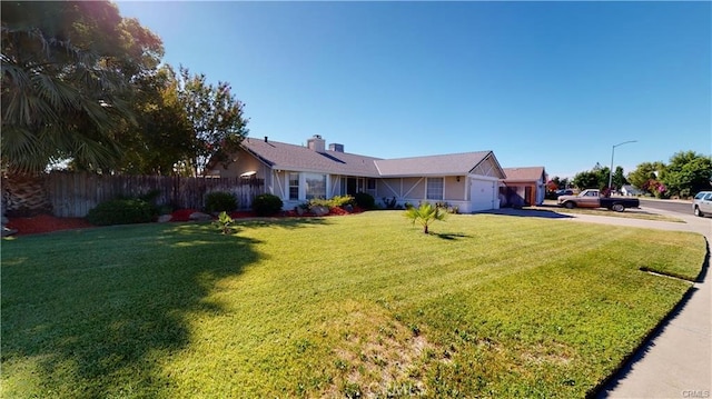 single story home featuring a front yard