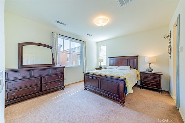 bedroom featuring light carpet