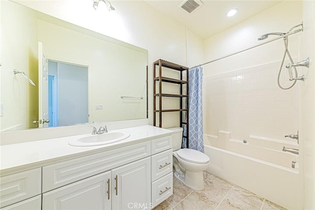 full bathroom with toilet, vanity, and shower / bath combo