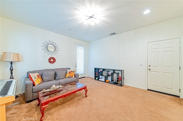 living room featuring light carpet