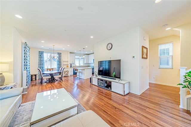 living room with light hardwood / wood-style flooring