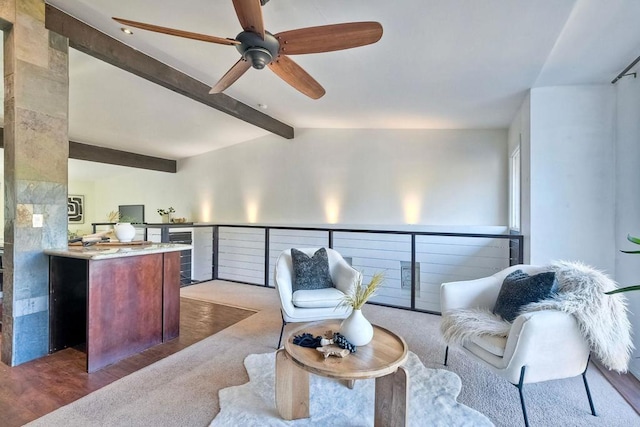 carpeted living room with lofted ceiling with beams, ceiling fan, and wine cooler