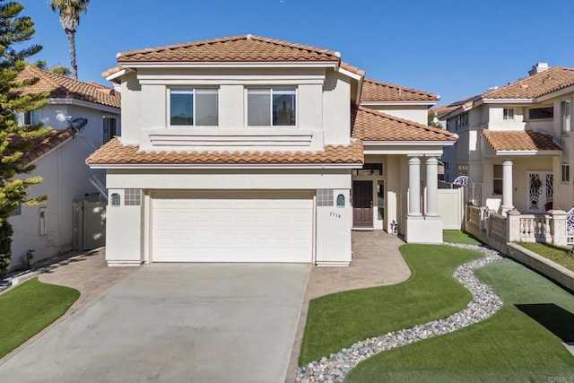 mediterranean / spanish-style house featuring a garage