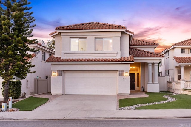 mediterranean / spanish house featuring a garage