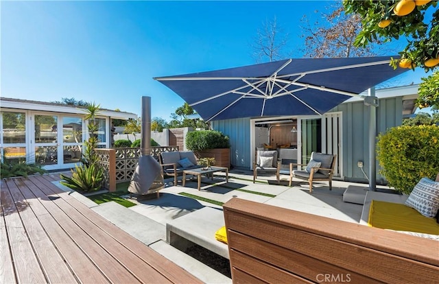 deck featuring outdoor lounge area