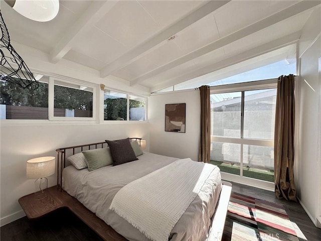 bedroom featuring dark hardwood / wood-style flooring and vaulted ceiling with beams