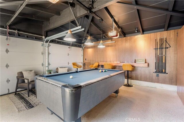 game room featuring billiards and wood walls