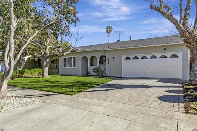 ranch-style home with a front yard and a garage